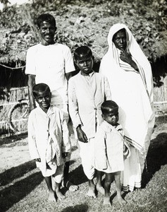 Indian couple with sons; India, ca. 1930