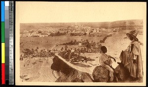 Two men view the city from a mountain outlook, Ghardaïa, Algeria, ca.1920-1940