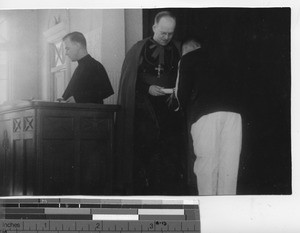 Bishop Lane giving out a diploma on Graduation Day at Dalian, China, 1937