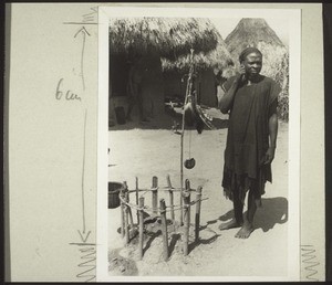 Bawe the magician from Mbembe with the magical objects in his compound