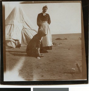 Young Boer woman in front of a tent in the camp near Mafikeng, South Africa, ca.1901-1903