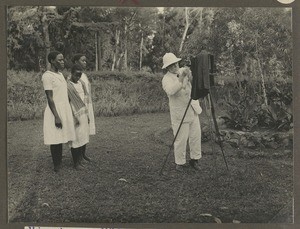 Missionary Emil Müller photographing his servants, Tanzania, ca.1931-1933