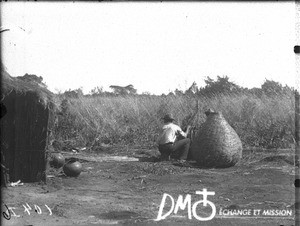 African man making a basket, Lemana, South Africa, ca. 1906-1915