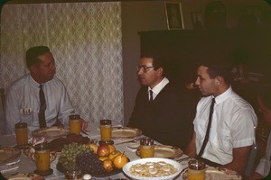 Four men at a meal