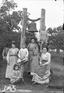 Group of women and children at the foot of a bell-tower, Valdezia, South Africa, ca. 1896-1911