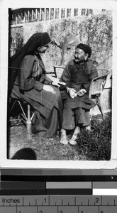 Maryknoll Sister talking to elderly Chinese woman, Kaying, China, ca. 1940