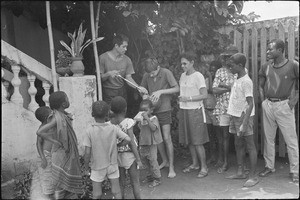 Mrs and M. George Kelly with a group of young people in Bohicon