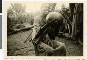 Dietrich Waßmann's landlady making butter, Guduru Gute, Ethiopia, ca.1952-1953