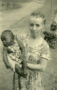 Dr Violette Brunet with a baby, in the day nursery of Ebeigne, Gabon