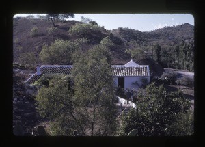 house and outbuildings