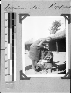 Women shaving their heads, Msangano, Tanzania, 1937