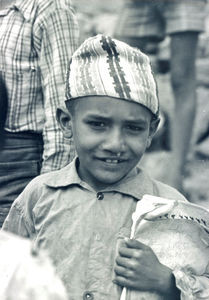 Boy in Nepal with his school papers, April 1984. (Used in: Børneposten no. 1 (1988).)