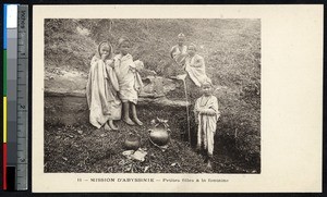 Five girls on a hillside gathered around a spring, Ethiopia, ca.1900-1930