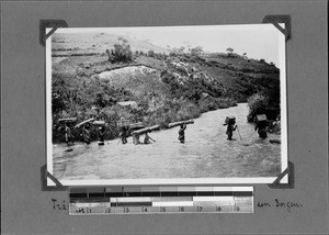 Caravan crossing Lufilyo River, Nyasa, Tanzania, ca.1891-1920