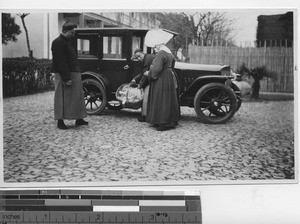 Men bring babies to Sisters at Shanghai, China, 1920