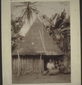 Drum of death in front of a hut in Nyasoso