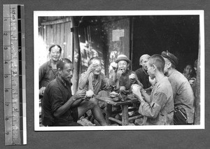 Tibetan men eating a meal, Tibet, China, ca.1941