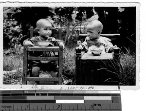 Two babies at lunch time at Liantan, China, 1935