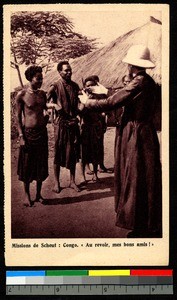 Missionary father speaks with locals, Congo, ca.1920-1940