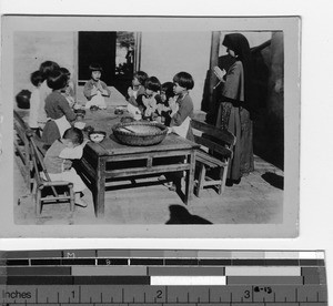 Prayers before the meal at Yangjiang, China, 1939