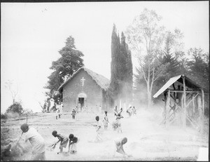 Children sweeping the path at the church, Gonja, Tanzania, ca.1927-1938