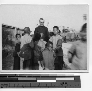 Maryknoll Brother with children in Hong Kong, China, 1925