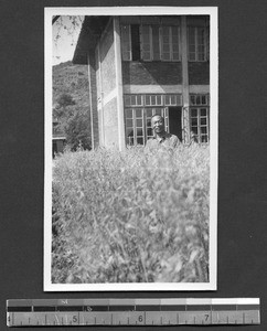 Dr. Li in oat field at Fukien Christian University, Fuzhou, Fujian, China, ca.1946