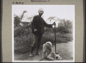 Ein 'besserer' Bettler, der mit seinem Hund allerlei Kunststücke macht