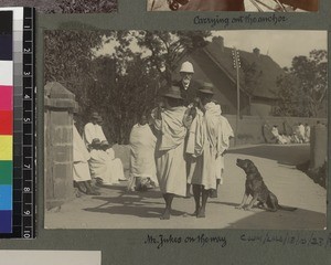 Missionary being transported by filanjana, Madagascar, ca. 1890