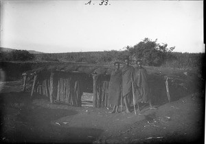 Africans in front of a hut, Tanzania, ca.1893-1920