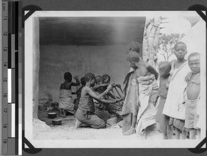 Schoolgirls cooking porridge, Unyamwezi, Tanzania