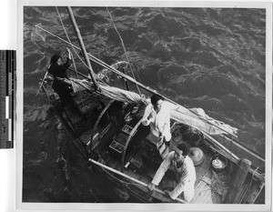 Peddlers selling wooden chests to sailors on board ship, Hong Kong, China, 1947