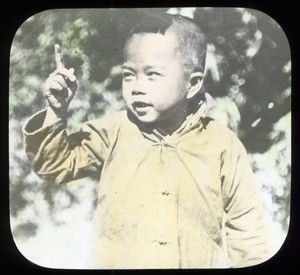 Boy gesturing with his right hand, China, ca. 1918-1938