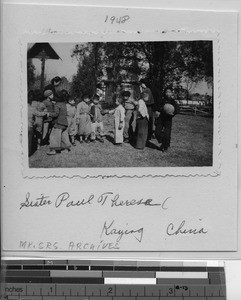 Maryknoll Sister with class of children at Meixien, China, 1948