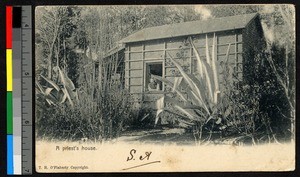 Priest leaning out the window of his house, South Africa, ca.1907