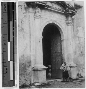 Filipina standing outside a church door, Manila, Philippines, September 1925