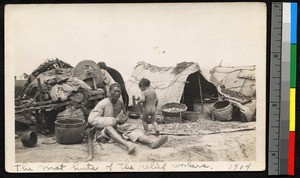 Relief workers resting outside of a hut, Jiangsu, China, ca.1905-1910