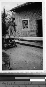 Man sawing wood, Loting, China, ca. 1936