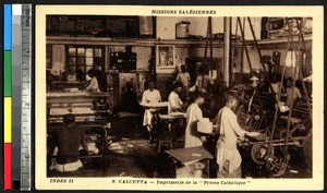 Young men working a newspaper printing press, Kolkata, India, ca.1920-1940