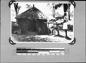 An African man preparing food, Nyasa, Tanzania, 1938