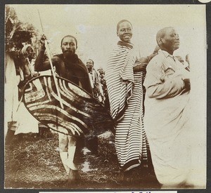 Man beating against shield, Tanzania