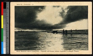 People wading on shoreline, Somalia, ca.1920-1940