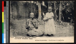 Seated grandmother and standing child, ca.1920-1940