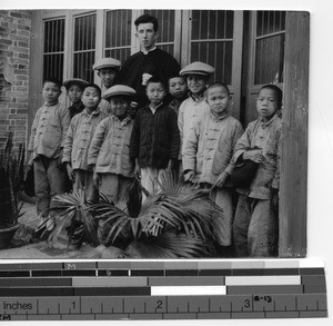 Fr. Gleason with school boys at Yangjiang, China, 1924