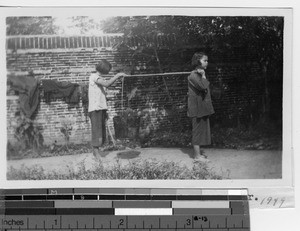 Blind girls carrying water at Yangjiang, China, 1949