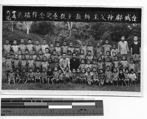 Fr. Larry Conley with children at Taishan, China, 1946