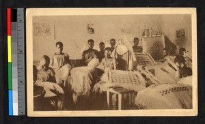 Missionary sister with girls weaving, Congo, ca.1920-1940