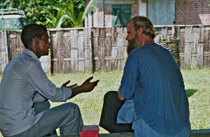 Missionary and Teacher, Filip Engsig-Karup talking with a local employee. Sent by the Danish Sa