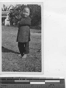 A young girl posing in Dongzhen, China, 1924
