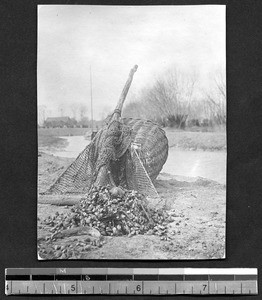 Net and basket by the water, Sichuan, China, ca.1912